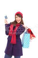 Brunette holding shopping bags and credit card