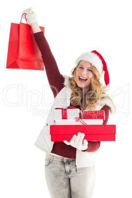 Festive blonde with shopping bag and gifts