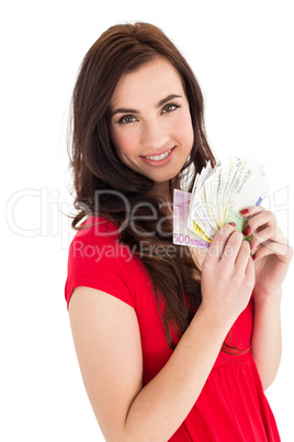 Cheerful brunette holding her cash