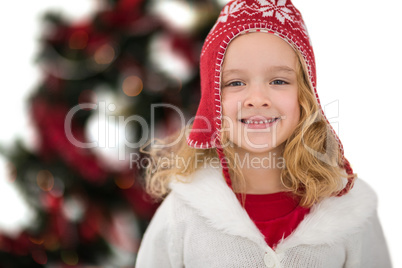 Festive little girl in hat and scarf