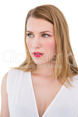 Portrait of a serious blonde woman looking away