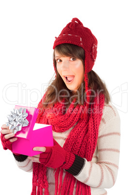 Festive brunette holding a gift