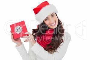 Joyful brunette presenting christmas gift