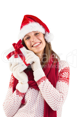 Attractive woman wearing santa hat with gift