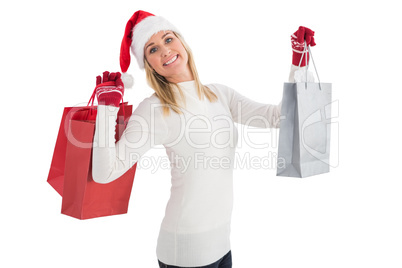 Festive blonde holding christmas gifts
