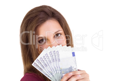 Festive brunette showing fan of euros