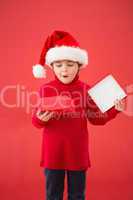 Festive little boy opening a gift