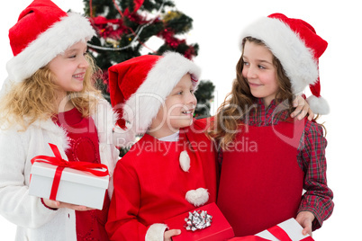 Festive little siblings holding gifts