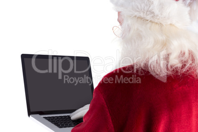 Santa Claus uses a laptop