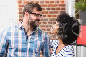 Casual man and woman looking at each other