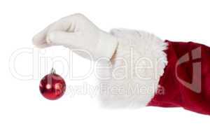 Santas hand is holding a Christmas bulb