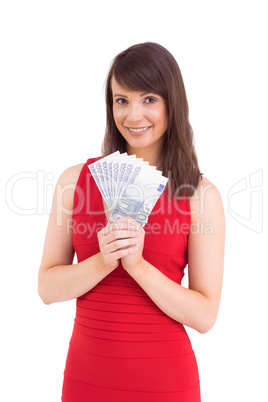 Brunette showing fan of dollars