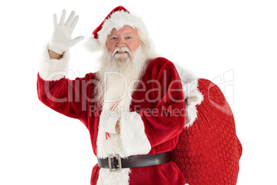 Santa waves to the camera