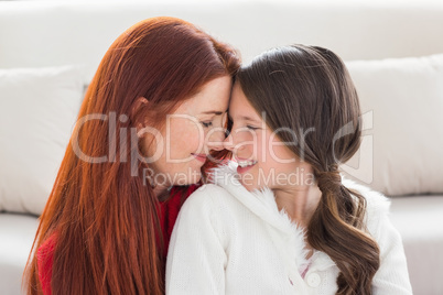 Mother and daughter smiling at each other Mother and daughter smiling at each other
