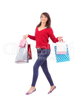 Excited brunette with shopping bags