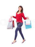 Excited brunette with shopping bags