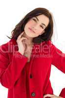 Portrait of a cheerful brunette in red coat