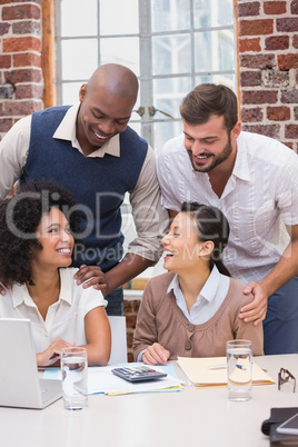 Cheerful creative business team in meeting