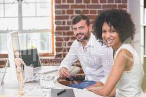 Smiling photo editors in office