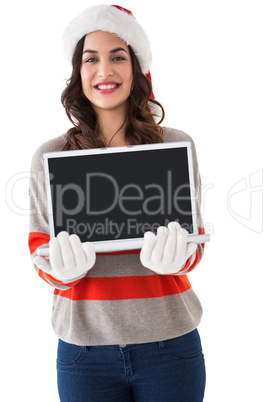 Festive brunette showing a laptop