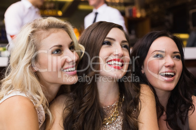 Happy friends having a drink together