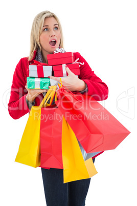 Festive blonde holding many gifts