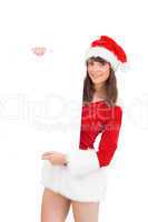 Pretty santa girl holding poster