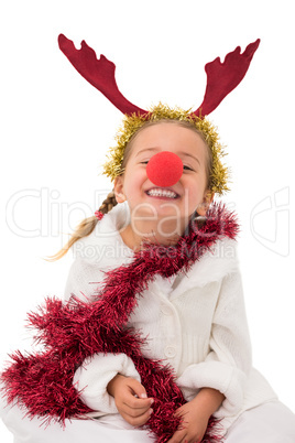 Cute little girl wearing red nose and tinsel