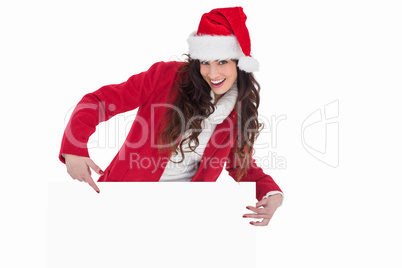 Festive brunette pointing white poster