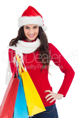 Brunette in winter clothes holding shopping bags