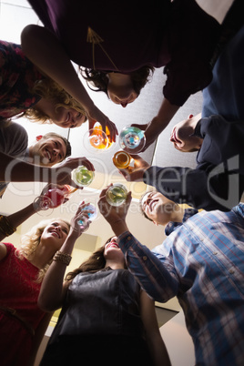 Happy friends having a drink together