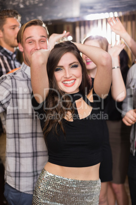 Stylish brunette smiling at camera