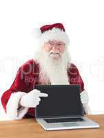 Santa shows something on the laptop