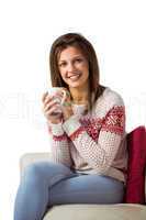 Woman sitting on the couch holding mug of coffee