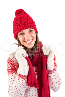 Smiling brunette in warm clothing looking at camera
