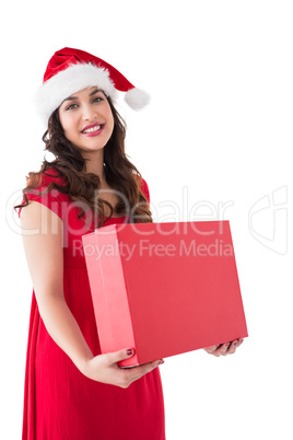 Festive brunette holding red box