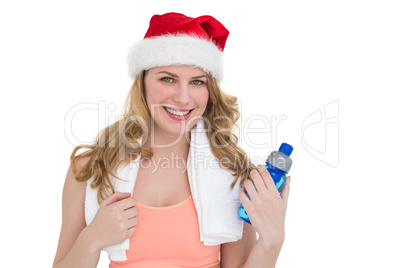 Festive fit blonde holding bottle of water