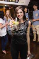 Pretty brunette holding a cocktail