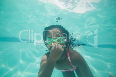 Cute kid posing underwater in pool