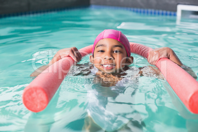 Cute kid swimming in the pool