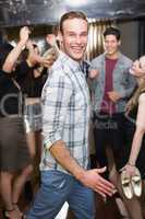Stylish man smiling on the dancefloor