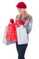 Blonde in winter clothes with shopping bags