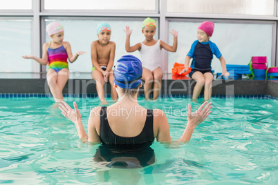 Cute swimming class watching the coach