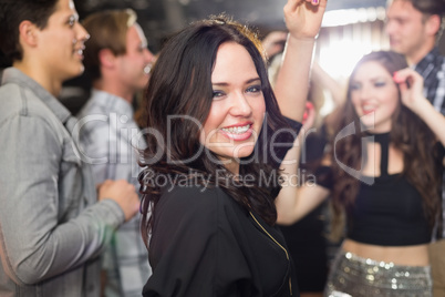 Stylish brunette smiling at camera