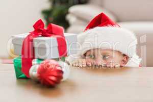 Festive little boy looking at gifts