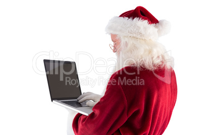 Santa Claus uses a laptop