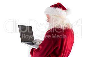 Santa Claus uses a laptop