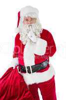 Santa holding his sack and keeping a secret