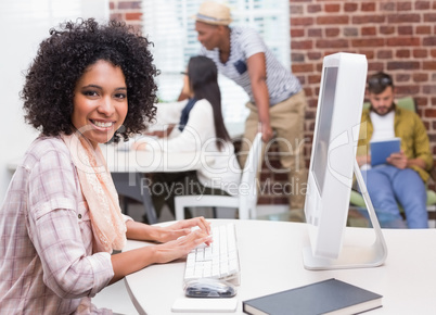 Portrait of casual young woman using computer Portrait of casual young woman using computer