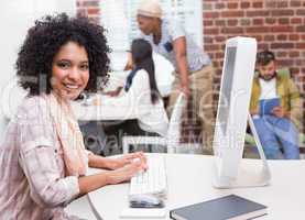 Portrait of casual young woman using computer